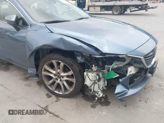 2014 Mazda 6 i Grand Touring with VIN JM1GJ1W64E1133729, listed as a IAAI auction lot 42050222 with 112,464 mi miles and . Bid and sale history available at DreamBid. Image 6.