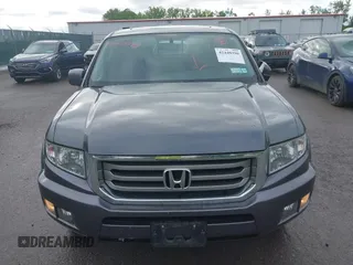 2014 Honda Ridgeline RTL with VIN 5FPYK1F5XEB011772, listed as a IAAI auction lot 42440390 with 145,219 mi miles and . Bid and sale history available at DreamBid. Image 12.