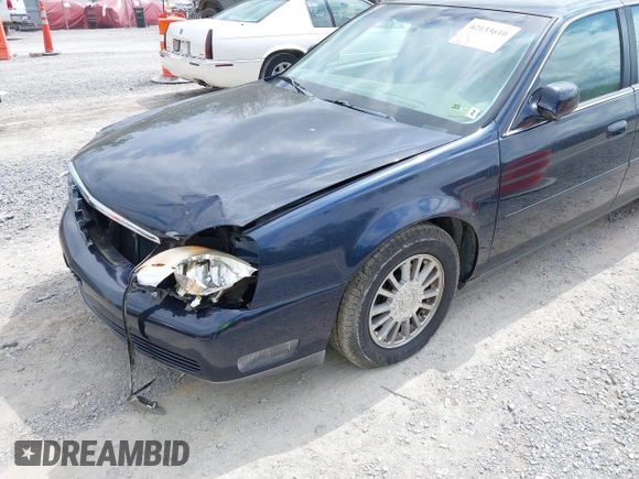 2004 Cadillac DeVille DHS z VIN 1G6KE54Y64U110060, wystawiony jako IAAI lot #42133610 z przebiegiem 68 677 mil mil oraz . Historia ofert i sprzedaży dostępna na DreamBid. Obrazek 12.