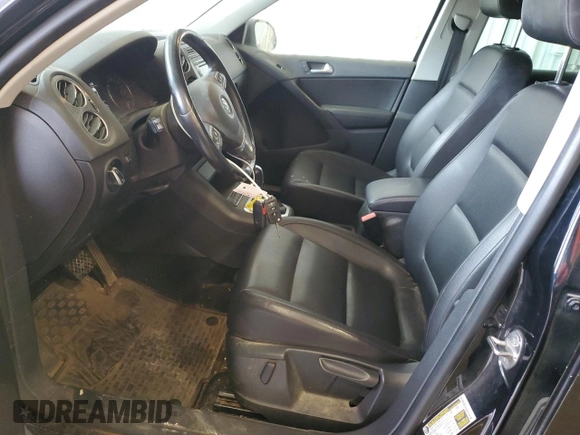 2013 Volkswagen Tiguan S with VIN WVGAV3AX1DW602083, listed as a Copart auction lot 57977515 with 114,375 mi miles and Clean title. Bid and sale history available at DreamBid. Image 7.