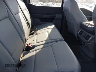 2023 Ford F-150 Lightning Pro with VIN 1FTVW1EL7PWG07081, listed as a IAAI auction lot 38702102 with 9,976 mi miles and . Bid and sale history available at DreamBid. Image 8.