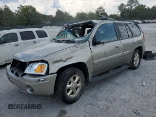 2002 GMC Envoy SLT with VIN 1GKDT13SX22380133, listed as a Copart auction lot 69816144 with 90,060 mi miles and Salvage Title. Bid and sale history available at DreamBid. Image 1.