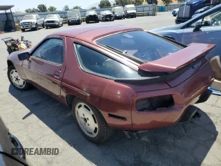 1986 Porsche 928 z VIN WP0JB0924GS860517, wystawiony jako Copart lot #58575324 z przebiegiem 105 961 mil mil oraz Szkody całkowita. Historia ofert i sprzedaży dostępna na DreamBid. Obrazek 2.