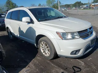 2013 Dodge Journey SXT with VIN 3C4PDCBG1DT563727, listed as a IAAI auction lot 42003852 with 202,516 mi miles. Bid and sale history available at carsss.com. Image 1.