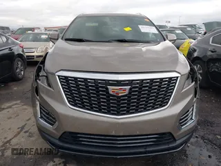 2023 Cadillac XT5 FWD Luxury z VIN 1GYKNAR45PZ140440, wystawiony jako IAAI lot #41723317 z przebiegiem 25 124 mil mil oraz . Historia ofert i sprzedaży dostępna na DreamBid. Obrazek 12.
