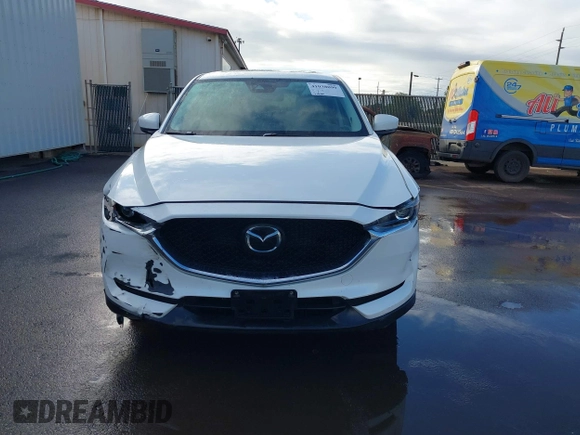 2018 Mazda CX-5 Touring with VIN JM3KFACM1J1431462, listed as a IAAI auction lot 41038099 with 77,489 mi miles. Bid and sale history available at carsss.com. Image 12.