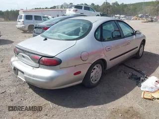 1999 Ford Taurus SE with VIN 1FAFP53U2XA322747, listed as a IAAI auction lot 41817160 with 230,319 mi miles. Bid and sale history available at carsss.com. Image 4.