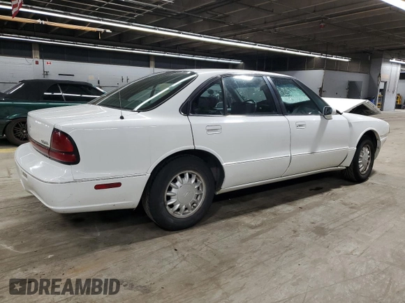 1998 Oldsmobile 88 LS z VIN 1G3HN52K9W4823866, wystawiony jako Copart lot #49150535 z przebiegiem 54 125 mil mil oraz Szkody całkowita. Historia ofert i sprzedaży dostępna na DreamBid. Obrazek 3.