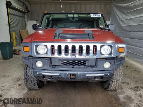 2003 Hummer H2 z VIN 5GRGN23U93H138182, wystawiony jako Copart lot #51842085 z przebiegiem 170 659 mil mil oraz Tytuł czysty. Historia ofert i sprzedaży dostępna na DreamBid. Obrazek 5.