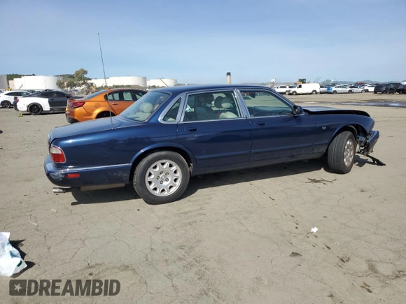 2000 Jaguar XJ with VIN SAJDA14C7YLF18873, listed as a Copart auction lot 50032495 with Not Provided miles and Salvage Title. Bid and sale history available at DreamBid. Image 3.