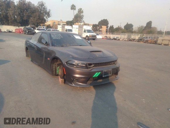 2019 Dodge Charger Scat Pack with VIN 2C3CDXGJ2KH564051, listed as a IAAI auction lot 41255283 with 64,687 mi miles and . Bid and sale history available at DreamBid. Image 1.