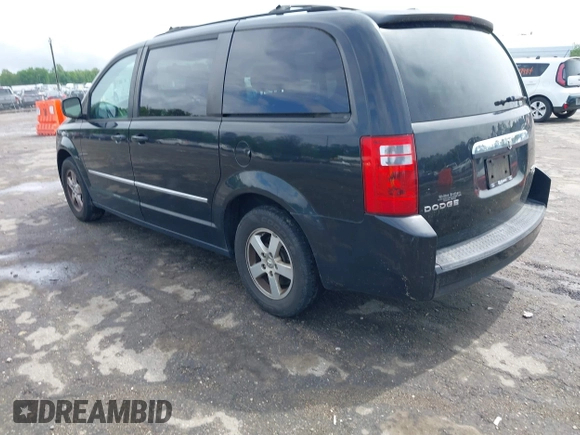 2010 Dodge Grand Caravan SXT with VIN 2D4RN5D11AR459864, listed as a IAAI auction lot 42197818 with 149,553 mi miles and . Bid and sale history available at DreamBid. Image 3.