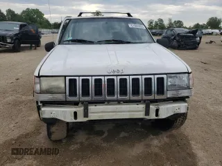 1995 Jeep Grand Cherokee Laredo z VIN 1J4GZ58S2SC578183, wystawiony jako Copart lot #61665955 z przebiegiem 341 135 mil mil oraz Szkoda całkowita • Salvage title. Historia ofert i sprzedaży dostępna na DreamBid. Obrazek 5.