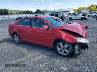 2009 Volkswagen Jetta SE with VIN 3VWRZ71K69M177746, listed as a Copart auction lot 70990074 with 128,390 mi miles and Salvage title. Bid and sale history available at DreamBid. Image 4.