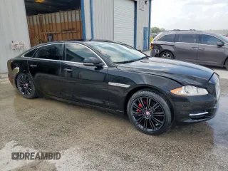 2014 Jaguar XJ Portfolio with VIN SAJWA2GZ2E8V64993, listed as a Copart auction lot 88774965 with 78,689 mi miles and Salvage title. Bid and sale history available at DreamBid. Image 4.