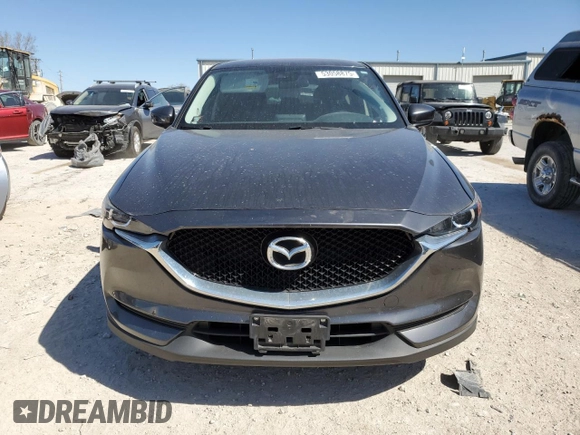 2017 Mazda CX-5 Touring with VIN JM3KFACL1H0100436, listed as a Copart auction lot 53058875 with 77,205 mi miles and Salvage Title. Bid and sale history available at DreamBid. Image 5.