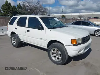 1998 Isuzu Rodeo S z VIN 4S2CK58W4W4308419, wystawiony jako IAAI lot #41711274 z przebiegiem 128 853 mil mil oraz . Historia ofert i sprzedaży dostępna na DreamBid. Obrazek 1.