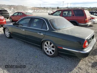 2004 Jaguar XJ with VIN SAJWA71C34SG29498, listed as a Copart auction lot 42653715 with 116,956 mi miles and Salvage Title. Bid and sale history available at carsss.com. Image 2.