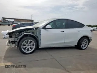 2023 Tesla Model Y Long Range z VIN 7SAYGDEE6PA123551, wystawiony jako Copart lot #56676005 z przebiegiem 24 033 mil mil oraz Szkoda całkowita • Salvage title. Historia ofert i sprzedaży dostępna na DreamBid. Obrazek 1.