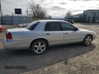 2003 Ford Crown Victoria LX z VIN 2FAFP74W03X122995, wystawiony jako Copart lot #55774415 z przebiegiem 234 485 mil mil oraz Czysty tytuł • Clean title. Historia ofert i sprzedaży dostępna na DreamBid. Obrazek 3.