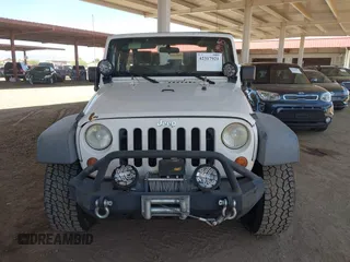2007 Jeep Wrangler X with VIN 1J4FA24137L128418, listed as a IAAI auction lot 42317921 with 148,412 mi miles and . Bid and sale history available at DreamBid. Image 12.