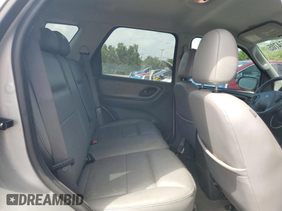 2006 Ford Escape Hybrid z VIN 1FMCU96H36KA35403, wystawiony jako Copart lot #65374705 z przebiegiem 127 689 mil mil oraz Czysty tytuł • Clean title. Historia ofert i sprzedaży dostępna na DreamBid. Obrazek 10.