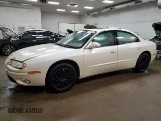 2003 Oldsmobile Aurora z VIN 1G3GS64C534171677, wystawiony jako Copart lot #74768254 z przebiegiem 113 932 mil mil oraz Tytuł czysty. Historia ofert i sprzedaży dostępna na DreamBid. Obrazek 1.