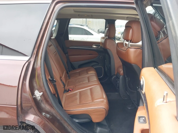 2015 Jeep Grand Cherokee Summit with VIN 1C4RJFJT7FC840560, listed as a IAAI auction lot 41596868 with 173,392 mi miles. Bid and sale history available at carsss.com. Image 8.