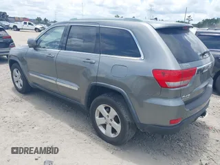 2011 Jeep Grand Cherokee Laredo with VIN 1J4RR4GG3BC595896, listed as a IAAI auction lot 42632333 with 135,426 mi miles and . Bid and sale history available at DreamBid. Image 3.