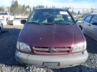 1999 Toyota Sienna CE with VIN 4T3ZF19C0XU151077, listed as a IAAI auction lot 41692028 with 1 mi miles. Bid and sale history available at carsss.com. Image 11.