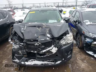 2014 Mazda CX-5 Touring with VIN JM3KE2CY2E0407453, listed as a IAAI auction lot 41564916 with 104,852 mi miles. Bid and sale history available at carsss.com. Image 11.