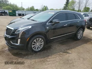 2024 Cadillac XT5 AWD Luxury z VIN 1GYKNBR4XRZ721747, wystawiony jako Copart lot #59309475 z przebiegiem 24 435 mil mil oraz Czysty tytuł • Clean title. Historia ofert i sprzedaży dostępna na DreamBid. Obrazek 1.