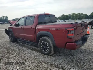 2022 Nissan Frontier Pro-4X with VIN 1N6ED1EK1NN601886, listed as a Copart auction lot 65182295 with 51,879 mi miles and Salvage title. Bid and sale history available at DreamBid. Image 2.