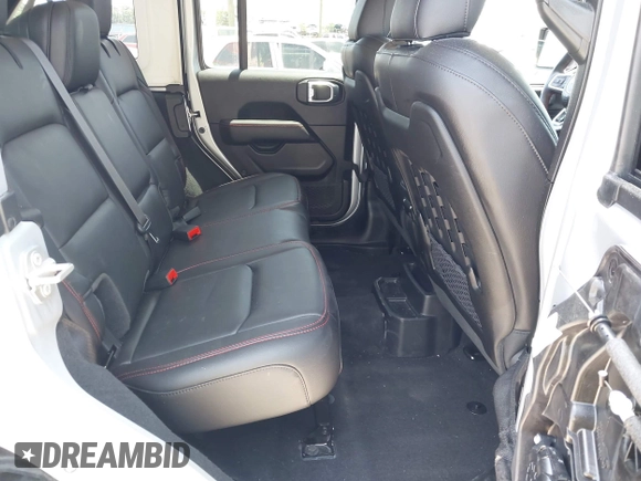 2023 Jeep Wrangler Rubicon with VIN 1C4JJXFG0PW522651, listed as a IAAI auction lot 42112210 with 7,744 mi miles and . Bid and sale history available at DreamBid. Image 8.
