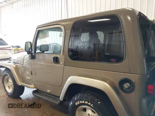 2003 Jeep Wrangler Sahara z VIN 1J4FA59S83P343234, wystawiony jako IAAI lot #41644074 z przebiegiem 197 461 mil mil oraz . Historia ofert i sprzedaży dostępna na DreamBid. Obrazek 14.