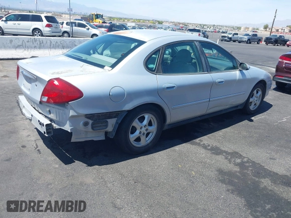 2003 Ford Taurus SE Standard with VIN 1FAFP53UX3G268265, listed as a IAAI auction lot 42090151 with 139,734 mi miles. Bid and sale history available at carsss.com. Image 4.