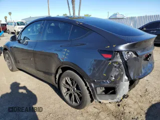 2024 Tesla Model Y with VIN 7SAYGDED3RF151031, listed as a Copart auction lot 49494165 with 7,503 mi miles and Salvage Title. Bid and sale history available at DreamBid. Image 2.