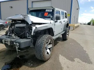 2012 Jeep Wrangler Unlimited Altitude with VIN 1C4HJWEG8CL163653, listed as a Copart auction lot 55279045 with 107,076 mi miles and Salvage title. Bid and sale history available at DreamBid. Image 14.