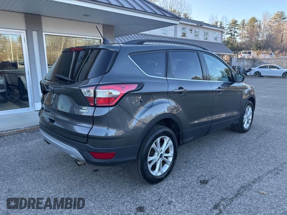 2018 Ford Escape SE with VIN 1FMCU9GD8JUA76991, listed as a IAAI auction lot 42013849 with 213,827 mi miles. Bid and sale history available at carsss.com. Image 4.