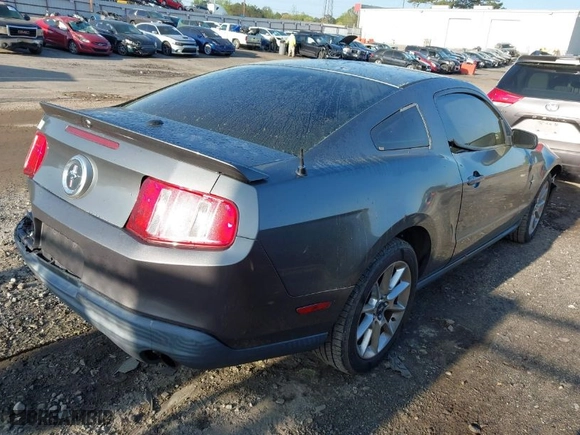 2010 Ford Mustang V6 with VIN 1ZVBP8AN6A5157773, listed as a IAAI auction lot 41921156 with 118,549 mi miles. Bid and sale history available at carsss.com. Image 4.