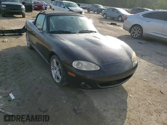 2004 Mazda MX-5 Miata LS with VIN JM1NB353140408906, listed as a Copart auction lot 56664715 with 86,603 mi miles and Salvage title. Bid and sale history available at DreamBid. Image 14.