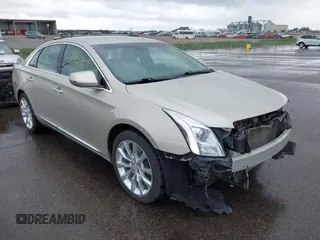 2016 Cadillac XTS Luxury Collection z VIN 2G61M5S36G9106081, wystawiony jako IAAI lot #42280790 z przebiegiem 84 340 mil mil oraz . Historia ofert i sprzedaży dostępna na DreamBid. Obrazek 1.