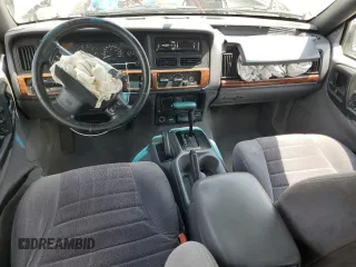1998 Jeep Grand Cherokee Laredo with VIN 1J4GZ58S4WC244954, listed as a Copart auction lot 55731465 with 205,766 mi miles and Salvage title. Bid and sale history available at DreamBid. Image 8.