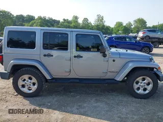 2015 Jeep Wrangler Unlimited Sahara with VIN 1C4BJWEG9FL570780, listed as a IAAI auction lot 42474940 with 116,226 mi miles and . Bid and sale history available at DreamBid. Image 14.