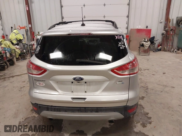 2014 Ford Escape SE z VIN 1FMCU9GX1EUD67624, wystawiony jako IAAI lot #41986362 z przebiegiem 79 921 mil mil oraz . Historia ofert i sprzedaży dostępna na DreamBid. Obrazek 16.
