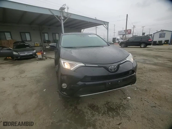 2018 Toyota RAV4 XLE with VIN 2T3WFREV2JW477138, listed as a Copart auction lot 47991815 with 128,417 mi miles and Salvage Title. Bid and sale history available at carsss.com. Image 11.