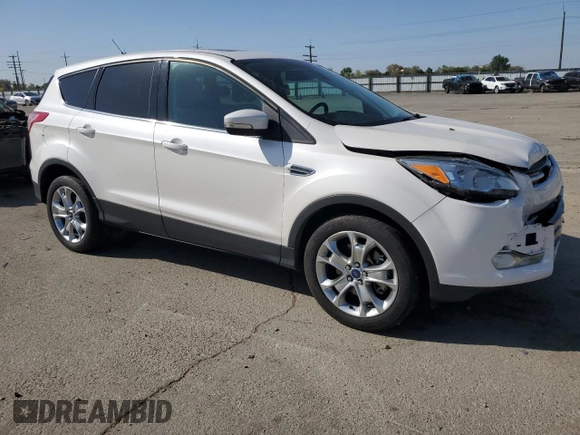 2013 Ford Escape SEL with VIN 1FMCU9H91DUC35459, listed as a Copart auction lot 55277545 with 130,081 mi miles and Salvage Title. Bid and sale history available at DreamBid. Image 4.