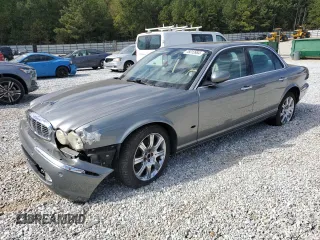 2006 Jaguar XJ with VIN SAJWA71B06SH03941, listed as a Copart auction lot 76013984 with 0 mi miles and Salvage Title. Bid and sale history available at carsss.com. Image 1.