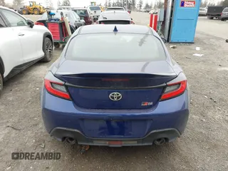 2023 Toyota GR86 Premium with VIN JF1ZNBE16P9764873, listed as a IAAI auction lot 41494323 with 9,906 mi miles. Bid and sale history available at carsss.com. Image 16.