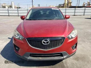 2014 Mazda CX-5 Touring with VIN JM3KE2CY9E0356050, listed as a Copart auction lot 65470674 with 70,400 mi miles and Salvage Title. Bid and sale history available at DreamBid. Image 5.